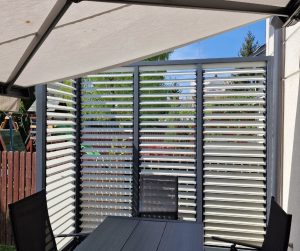 Painted sliding louvres; side enclosure for a terrace or balcony; Aluminium Frame Plus Painted Wood